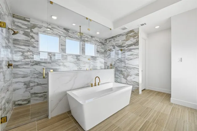 a bathroom with a sink a mirror and shower