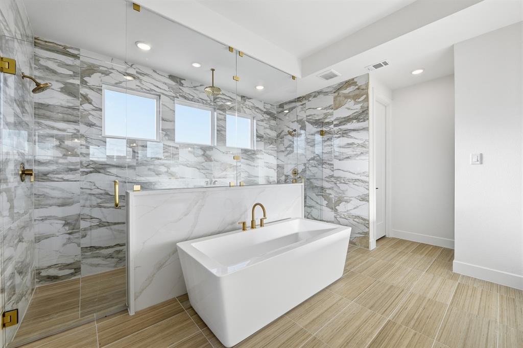 3700 Meander Way Prosper, TX 75078 - Photo 13 of 29 a bathroom with a sink a mirror and shower