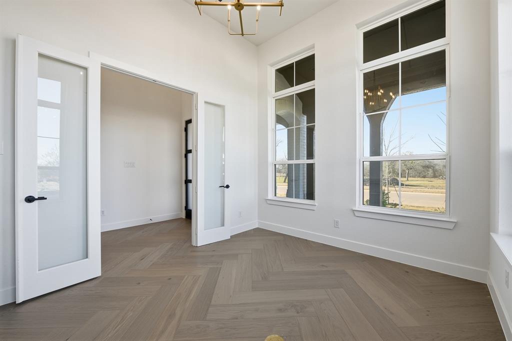3700 Meander Way Prosper, TX 75078 - Photo 18 of 29 an empty room with windows and closet