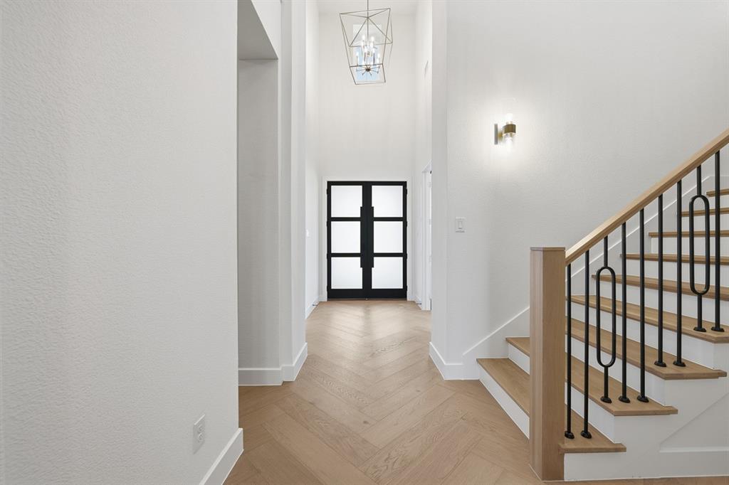 3700 Meander Way Prosper, TX 75078 - Photo 21 of 29 a view of a hallway with wooden floor and entryway