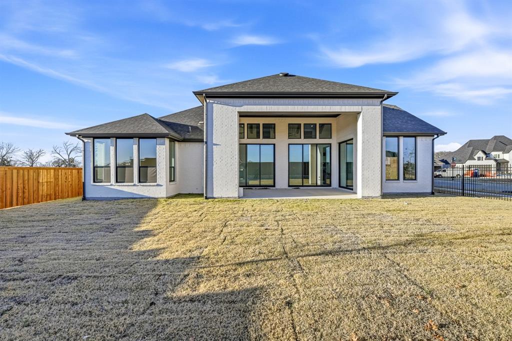 3700 Meander Way Prosper, TX 75078 - Photo 27 of 29 a front view of a house with a garden