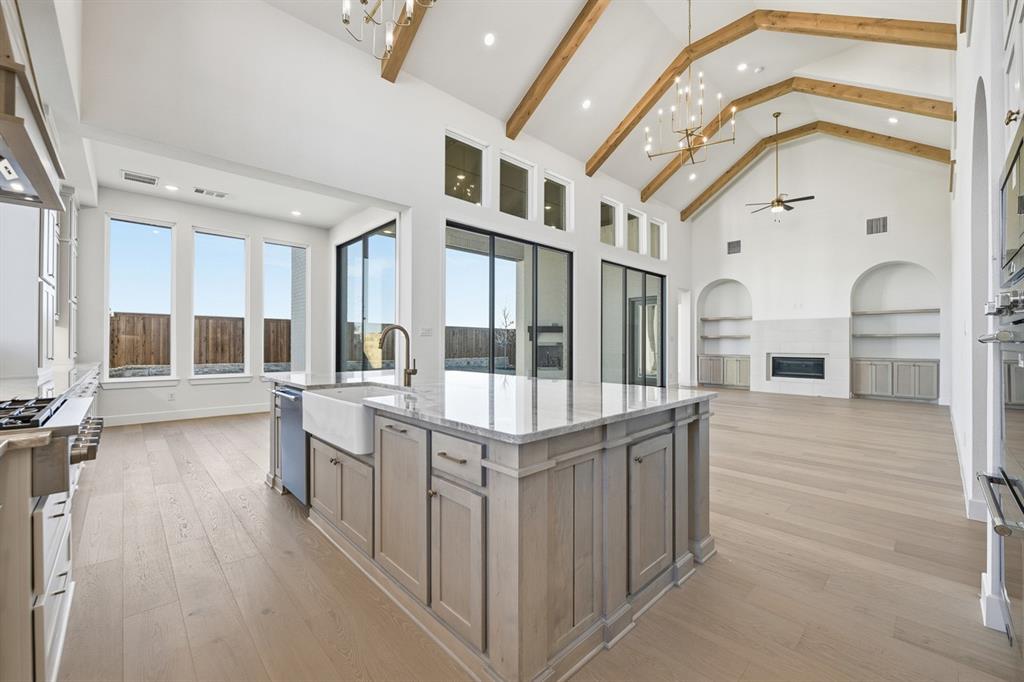 3700 Meander Way Prosper, TX 75078 - Photo 4 of 29 a very nice looking room with a large window and wooden floor