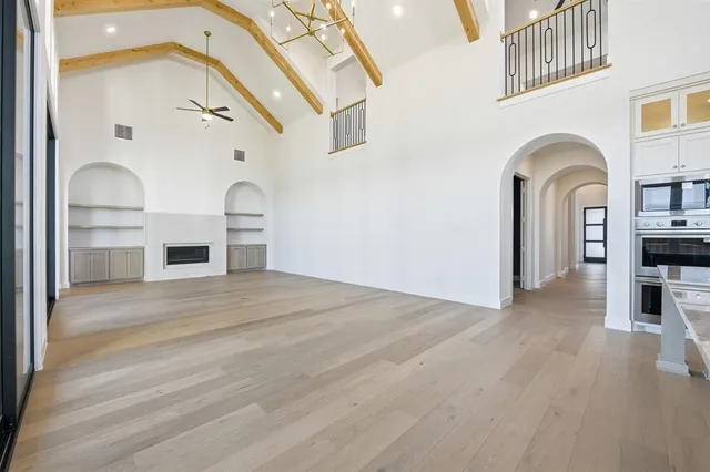 a view of living room with furniture and fireplace