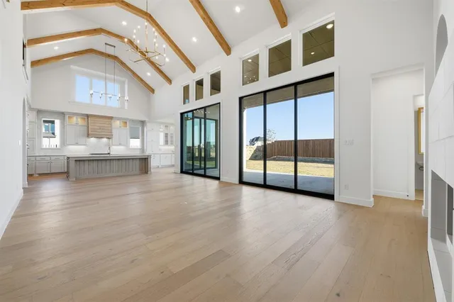 a view of an entryway with wooden floor and windows