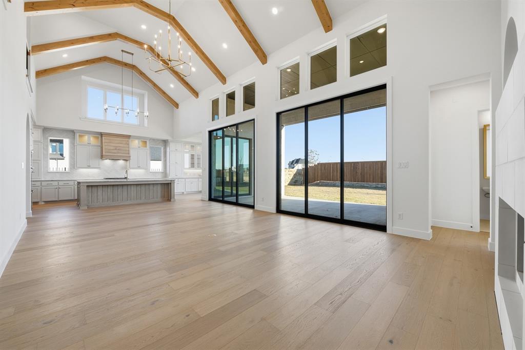 3700 Meander Way Prosper, TX 75078 - Photo 8 of 29 a view of an entryway with wooden floor and windows