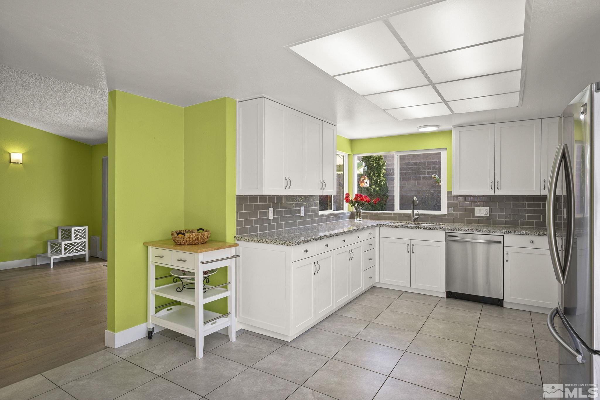 920 Pinebrook Road Reno, NV 89509 - Photo 12 of 40 a kitchen with a sink and chairs