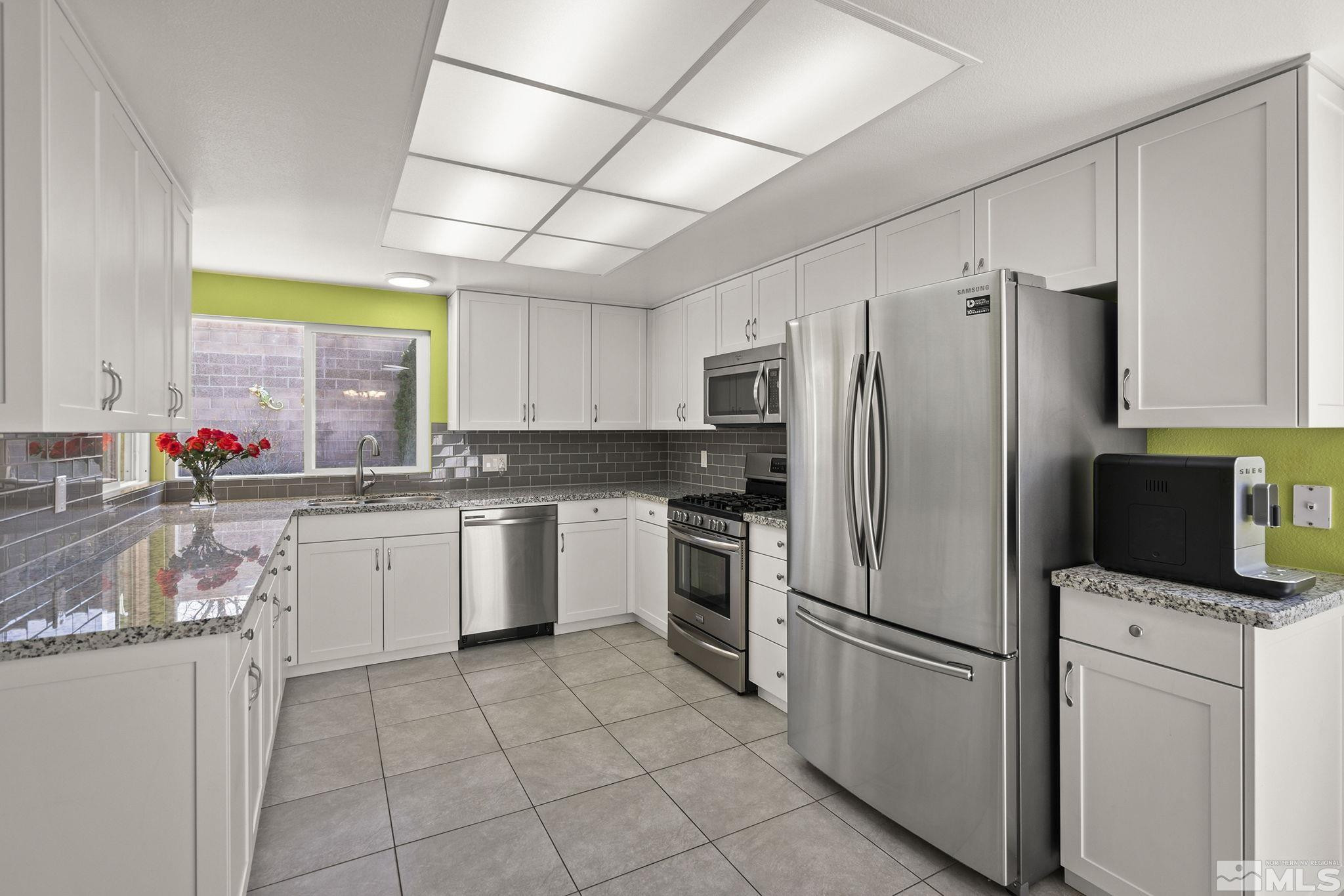920 Pinebrook Road Reno, NV 89509 - Photo 14 of 40 a kitchen with a refrigerator sink and microwave