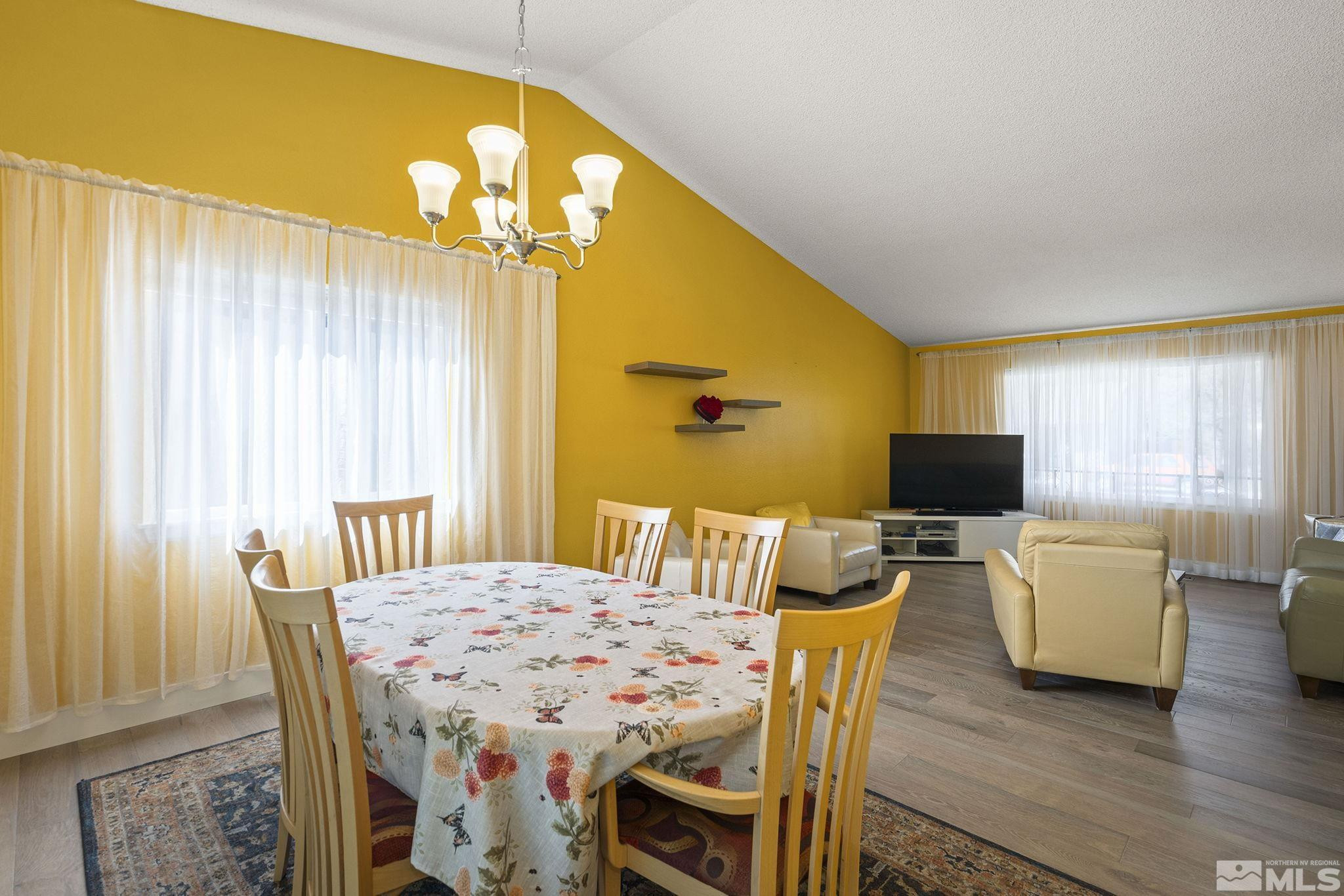 920 Pinebrook Road Reno, NV 89509 - Photo 17 of 40 a view of a dining room with furniture and wooden floor