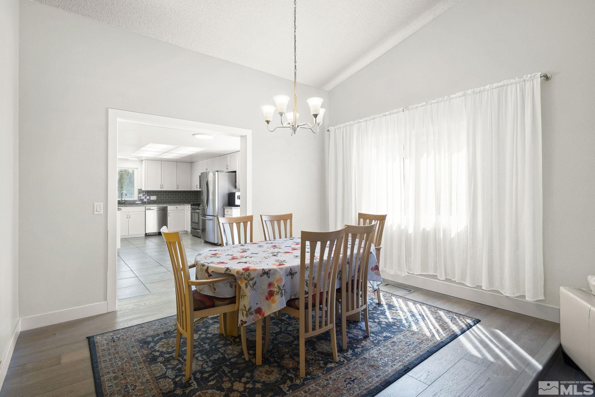 920 Pinebrook Road Reno, NV 89509 - Photo 18 of 40 a view of a dining room with furniture and window
