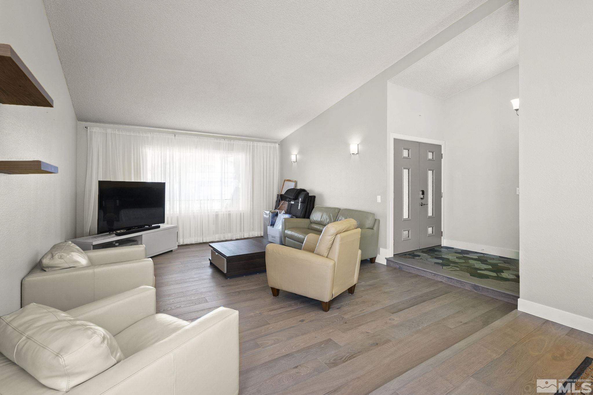 920 Pinebrook Road Reno, NV 89509 - Photo 22 of 40 a living room with furniture and a flat screen tv