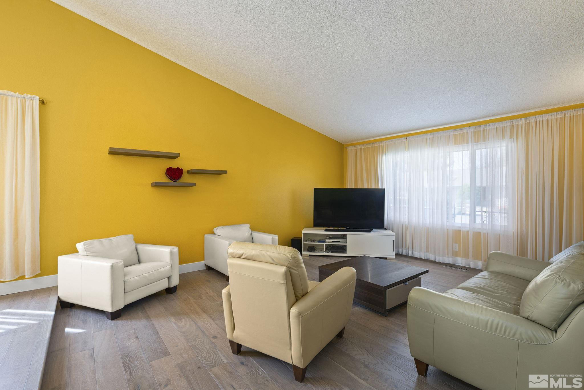 920 Pinebrook Road Reno, NV 89509 - Photo 23 of 40 a living room with furniture and a flat screen tv