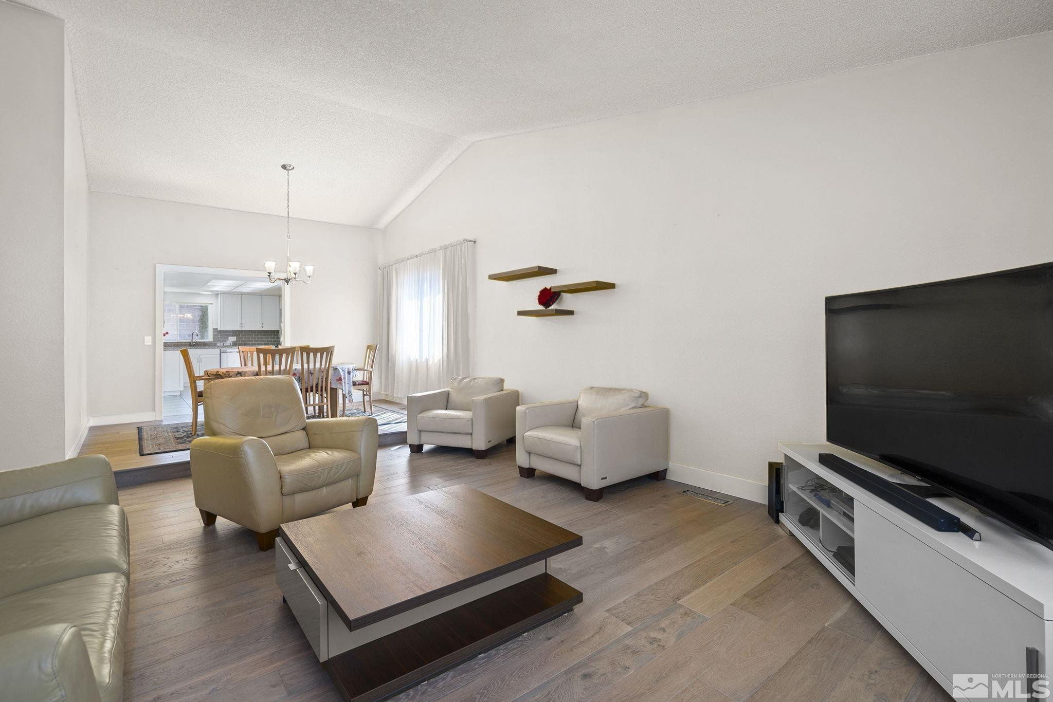 920 Pinebrook Road Reno, NV 89509 - Photo 24 of 40 a living room with furniture and a flat screen tv
