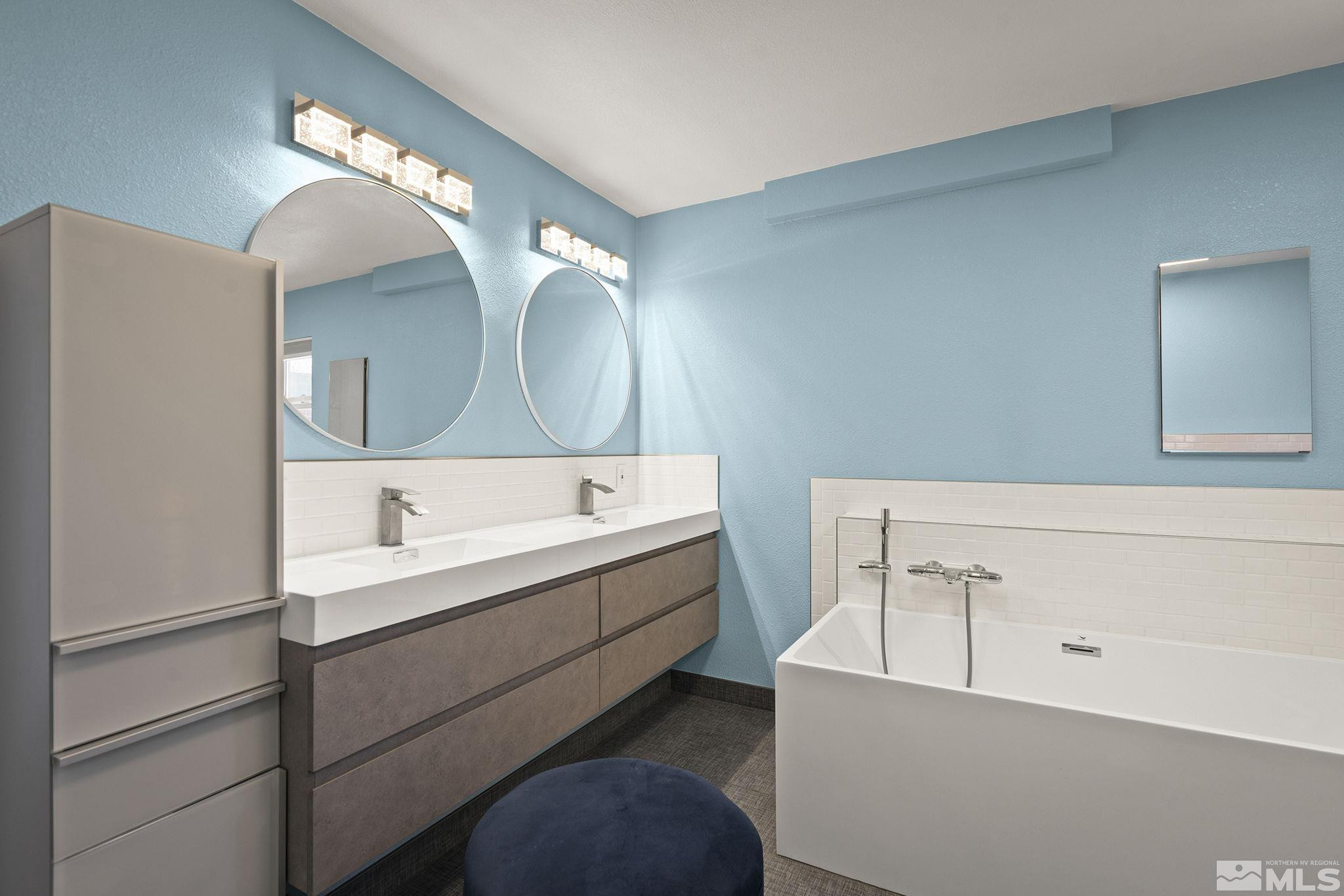 920 Pinebrook Road Reno, NV 89509 - Photo 27 of 40 a bathroom with a double vanity sink mirror and bathtub