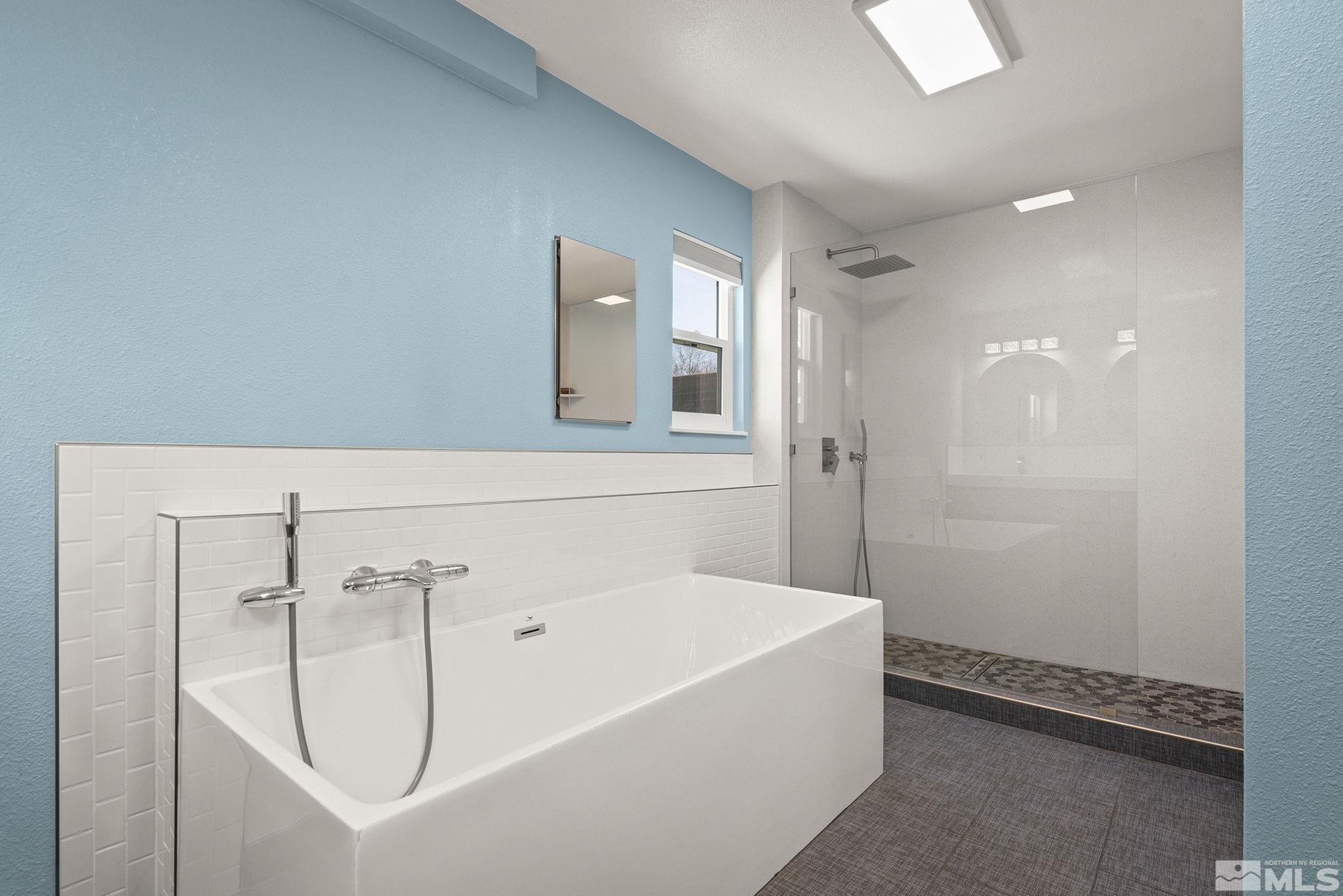 920 Pinebrook Road Reno, NV 89509 - Photo 28 of 40 a bathroom with a bathtub and shower