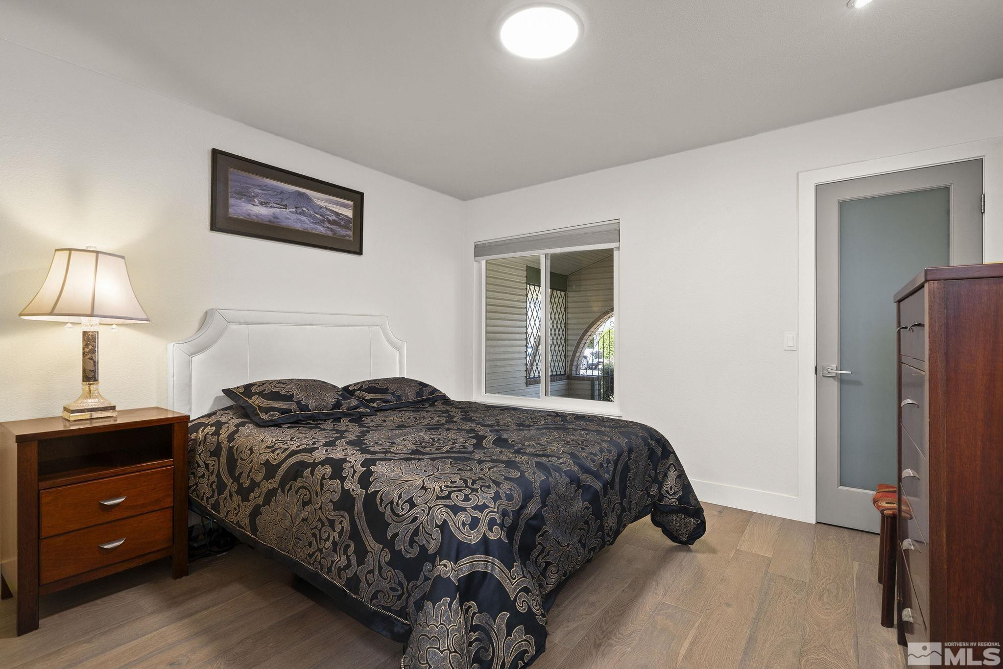 920 Pinebrook Road Reno, NV 89509 - Photo 31 of 40 a bedroom with a bed and a night stand