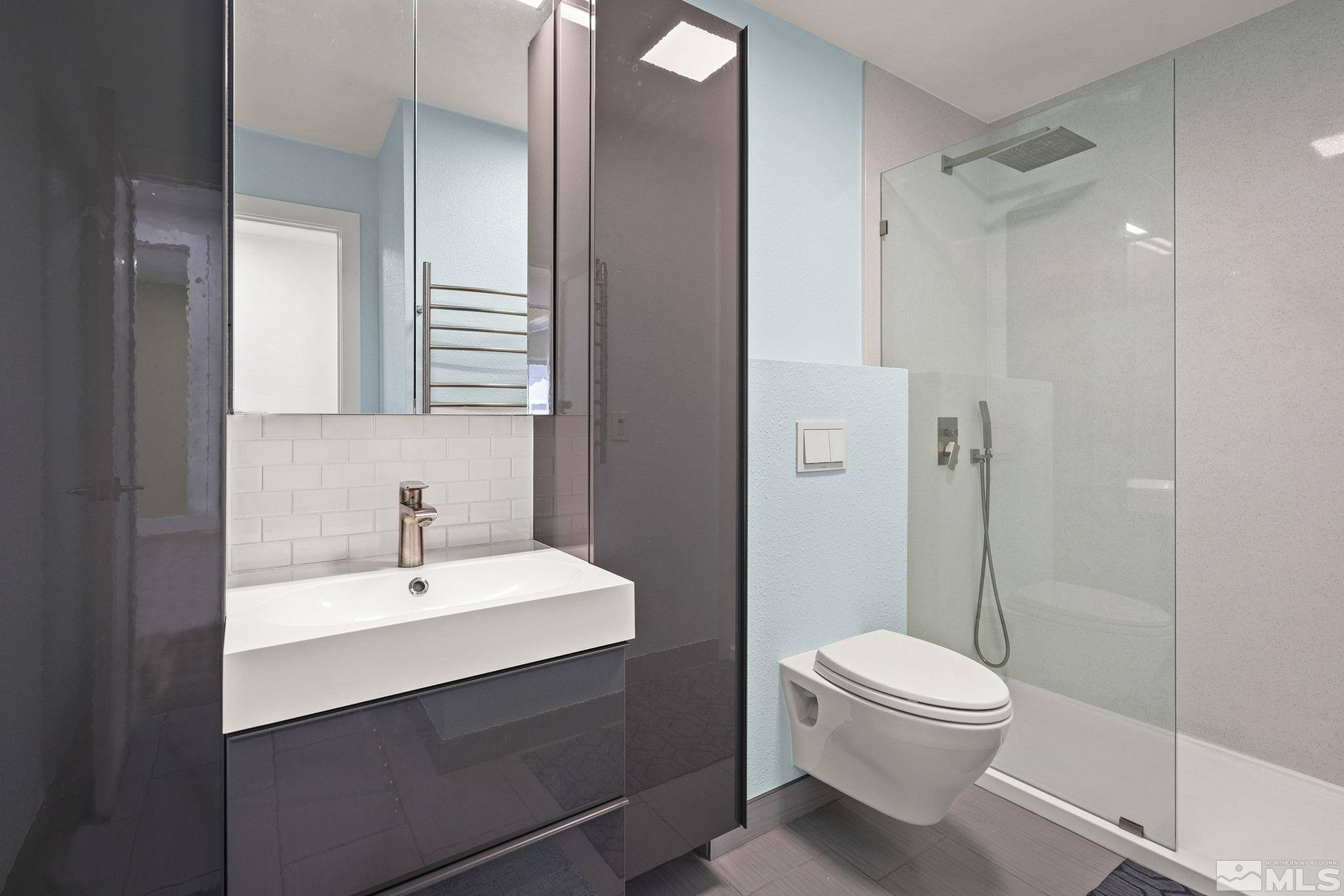 920 Pinebrook Road Reno, NV 89509 - Photo 36 of 40 a bathroom with a sink a toilet and shower