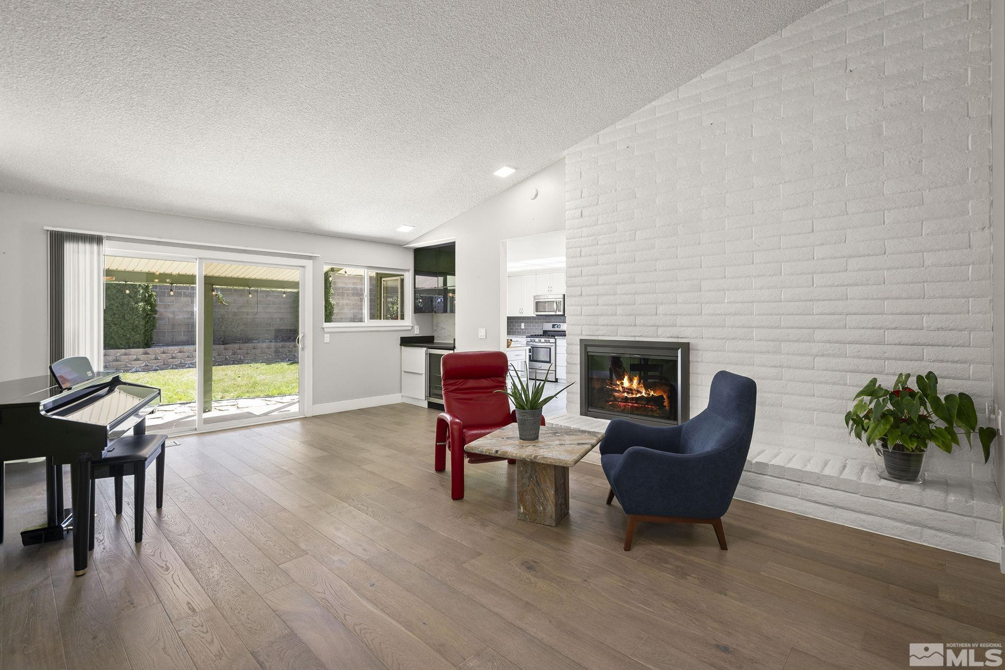 920 Pinebrook Road Reno, NV 89509 - Photo 4 of 40 a living room with furniture and a fireplace