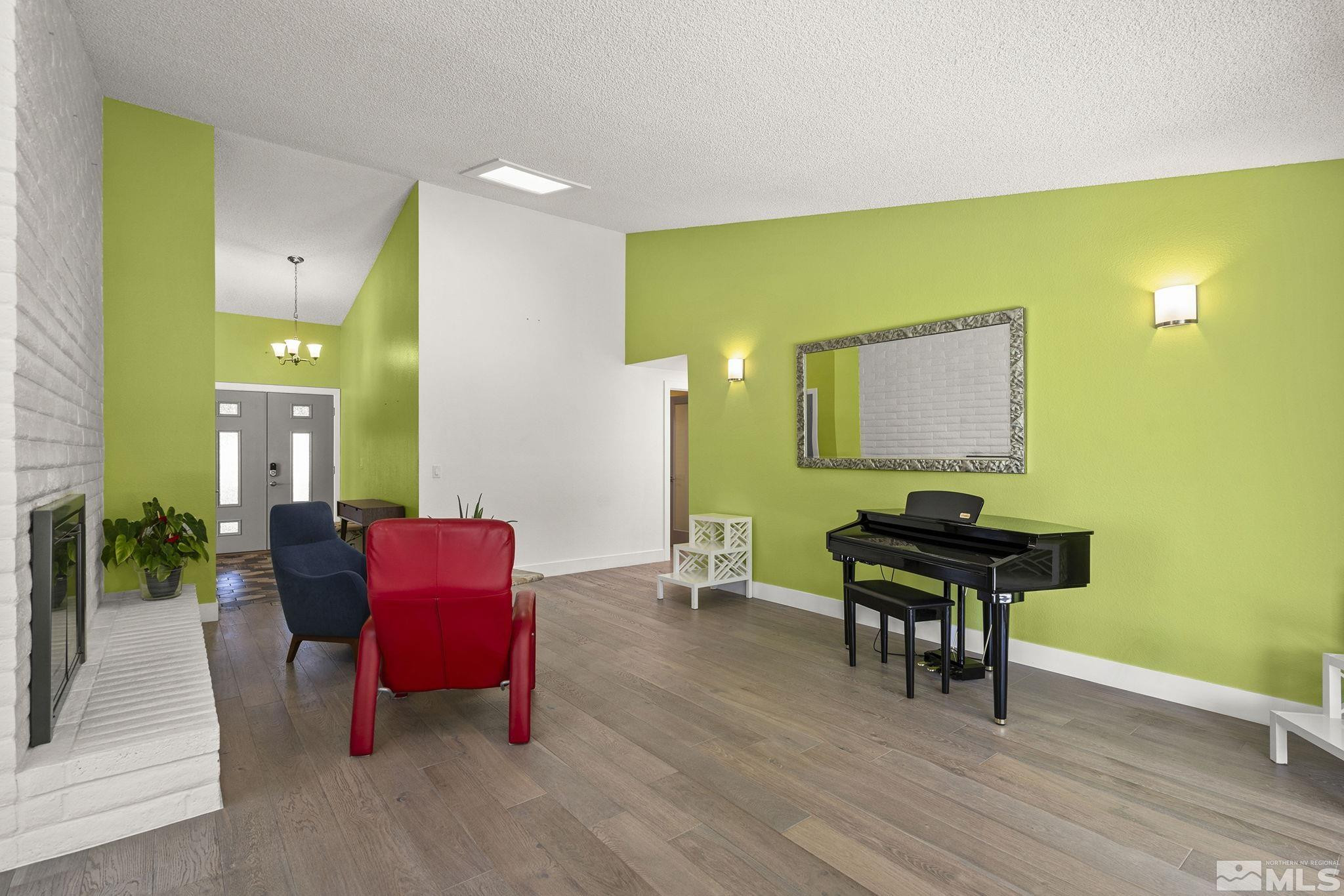 920 Pinebrook Road Reno, NV 89509 - Photo 7 of 40 a view of a workspace room with wooden floor and furniture
