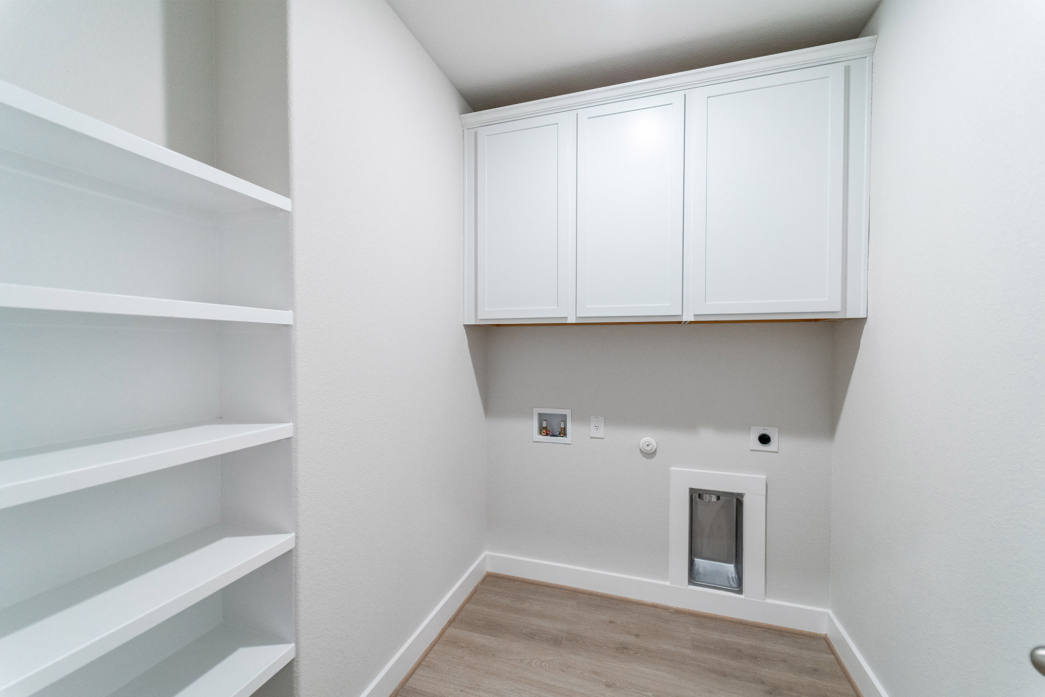 871 Cherrystone Loop Buda, TX 78610 - Photo 10 of 20 a view of storage and utility room with cabinets