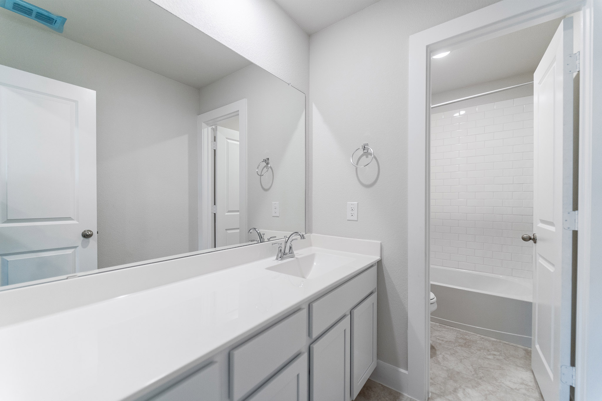 871 Cherrystone Loop Buda, TX 78610 - Photo 16 of 20 a bathroom with a sink and a mirror