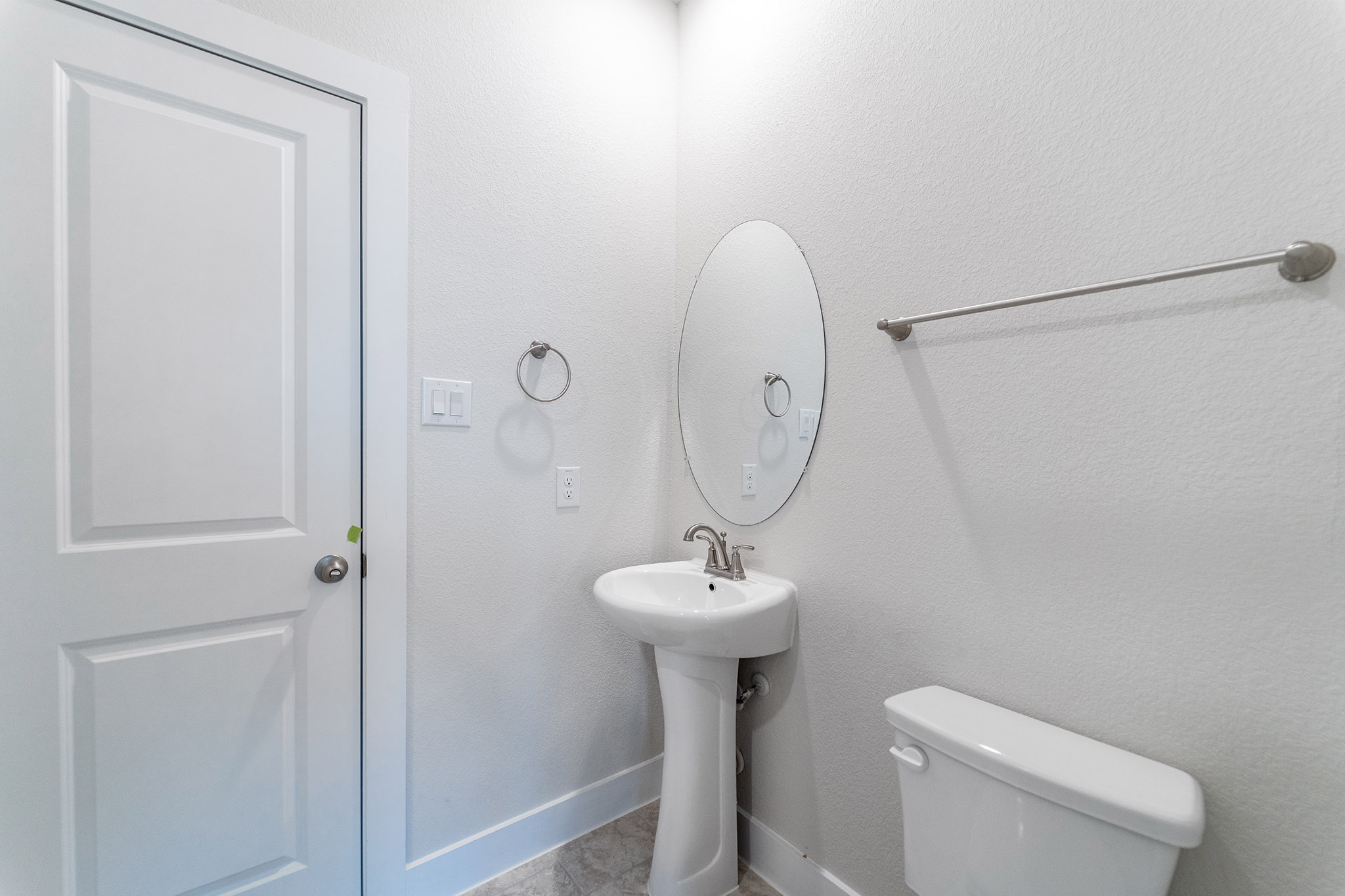 871 Cherrystone Loop Buda, TX 78610 - Photo 18 of 20 a bathroom with a sink a toilet and a mirror