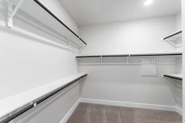 a spacious bathroom with a tub sink shower and mirror