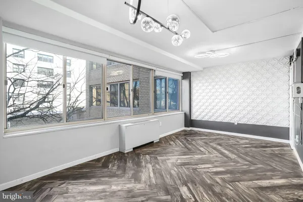 a view of an empty room with a window