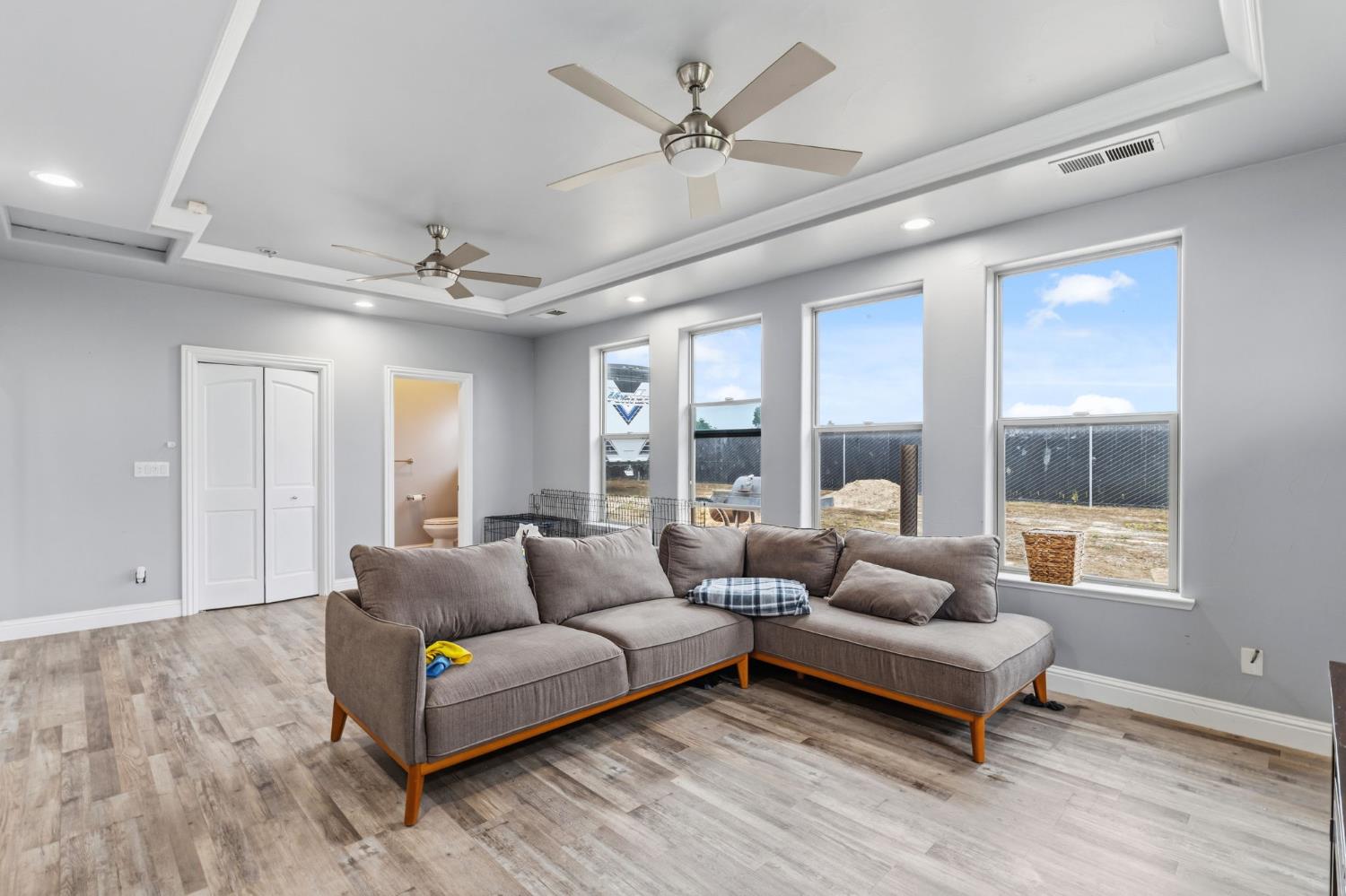 17703 El Camino Road Madera, CA 93636 - Photo 28 of 64 a living room with furniture and a large window