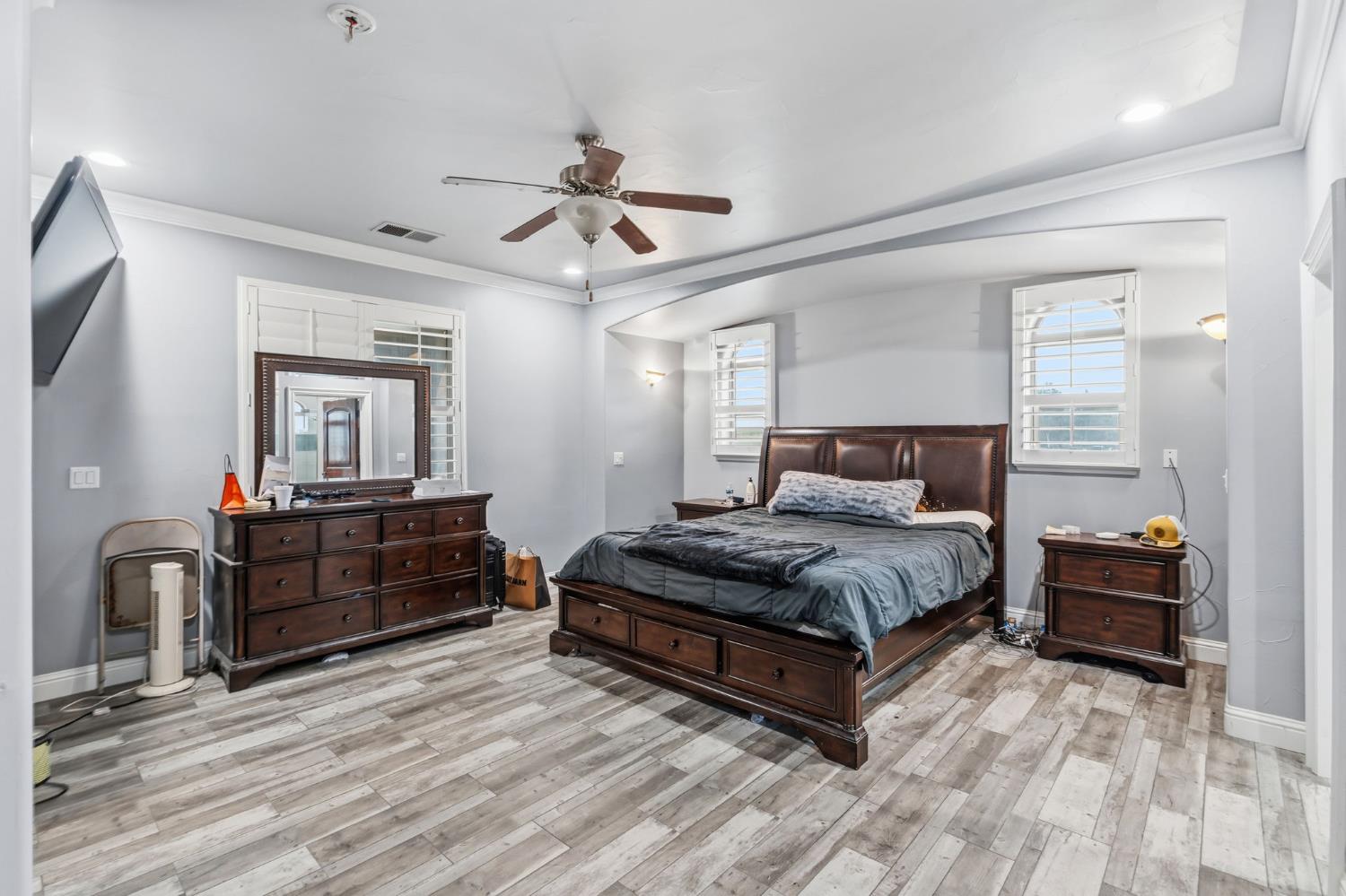 17703 El Camino Road Madera, CA 93636 - Photo 34 of 64 a bedroom with a bed and wooden floor
