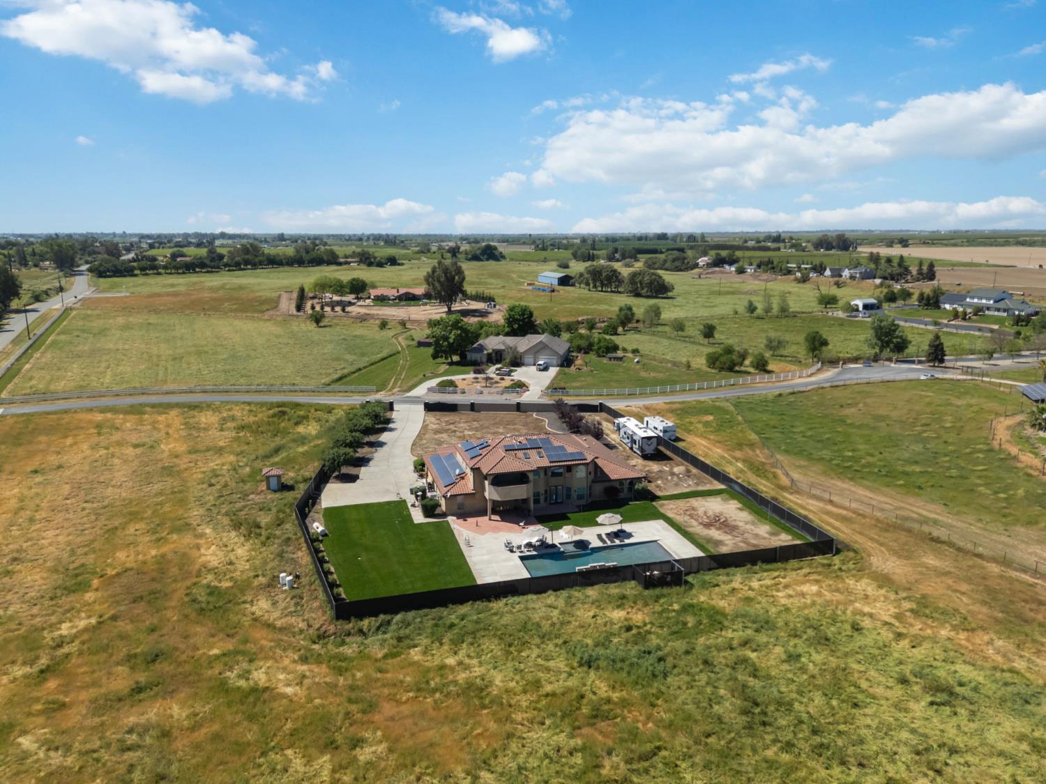 17703 El Camino Road Madera, CA 93636 - Photo 62 of 64 an aerial view of a residential houses with outdoor space and ocean view