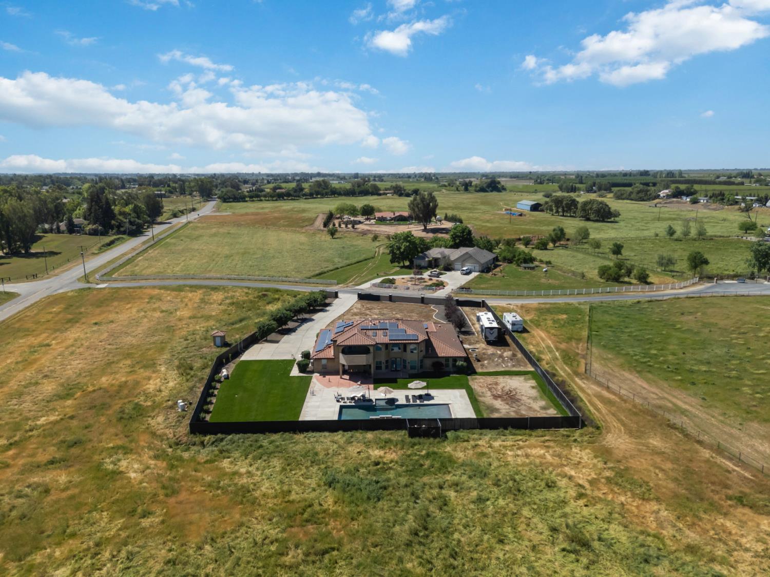 17703 El Camino Road Madera, CA 93636 - Photo 63 of 64 an aerial view of a house with a lake view