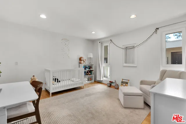 a bedroom with furniture and a table