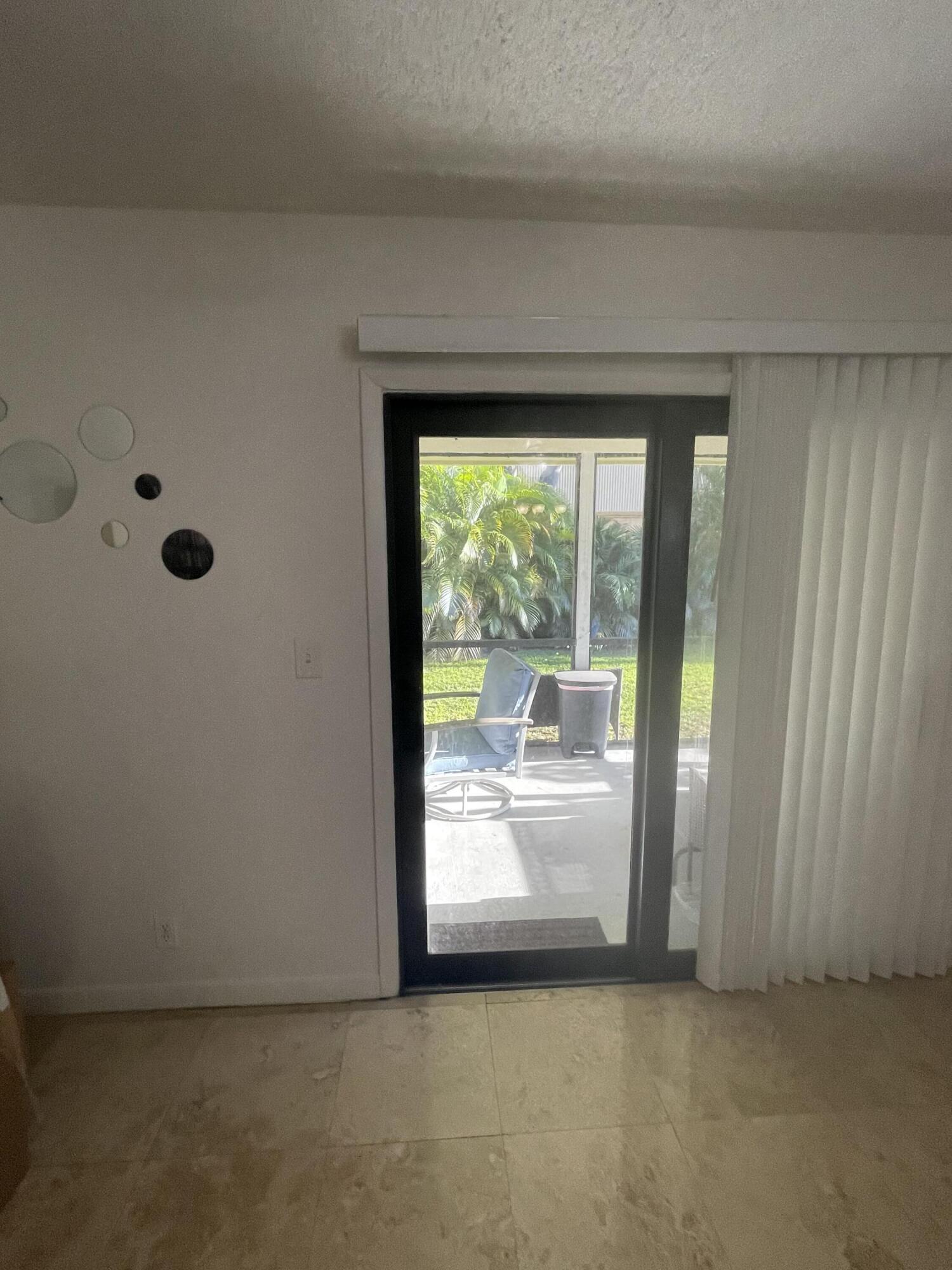 468 Northeast 42nd Street Boca Raton, FL 33431 - Photo 11 of 37 Living Sliding Door to Patio