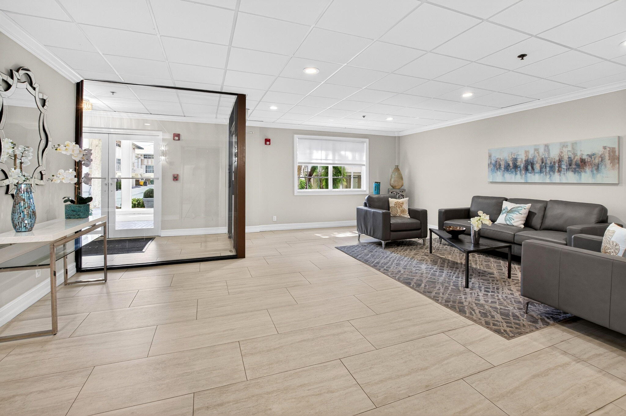 950 De Soto Road, Unit 5A Boca Raton, FL 33432 - Photo 64 of 98 a living room with furniture and a table