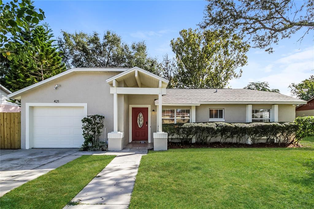 a front view of a house with garden
