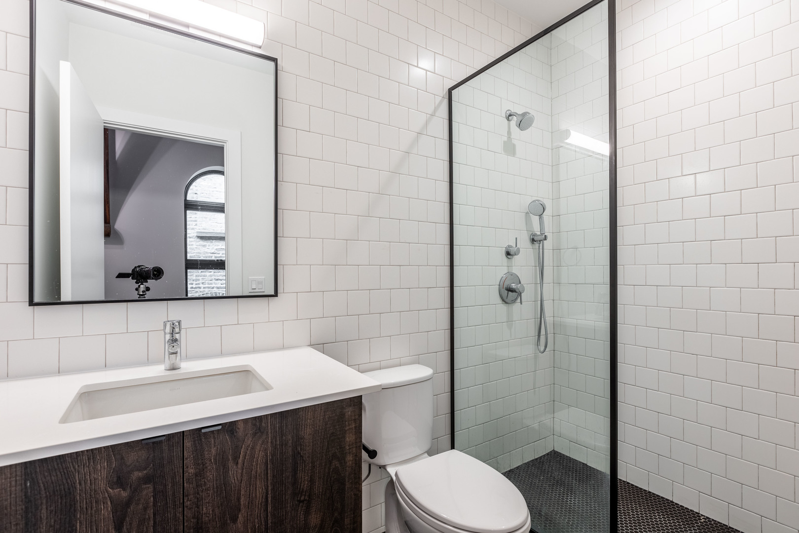 Undisclosed Address Chicago, IL 60647 - Photo 11 of 17 a bathroom with a sink vanity toilet and shower