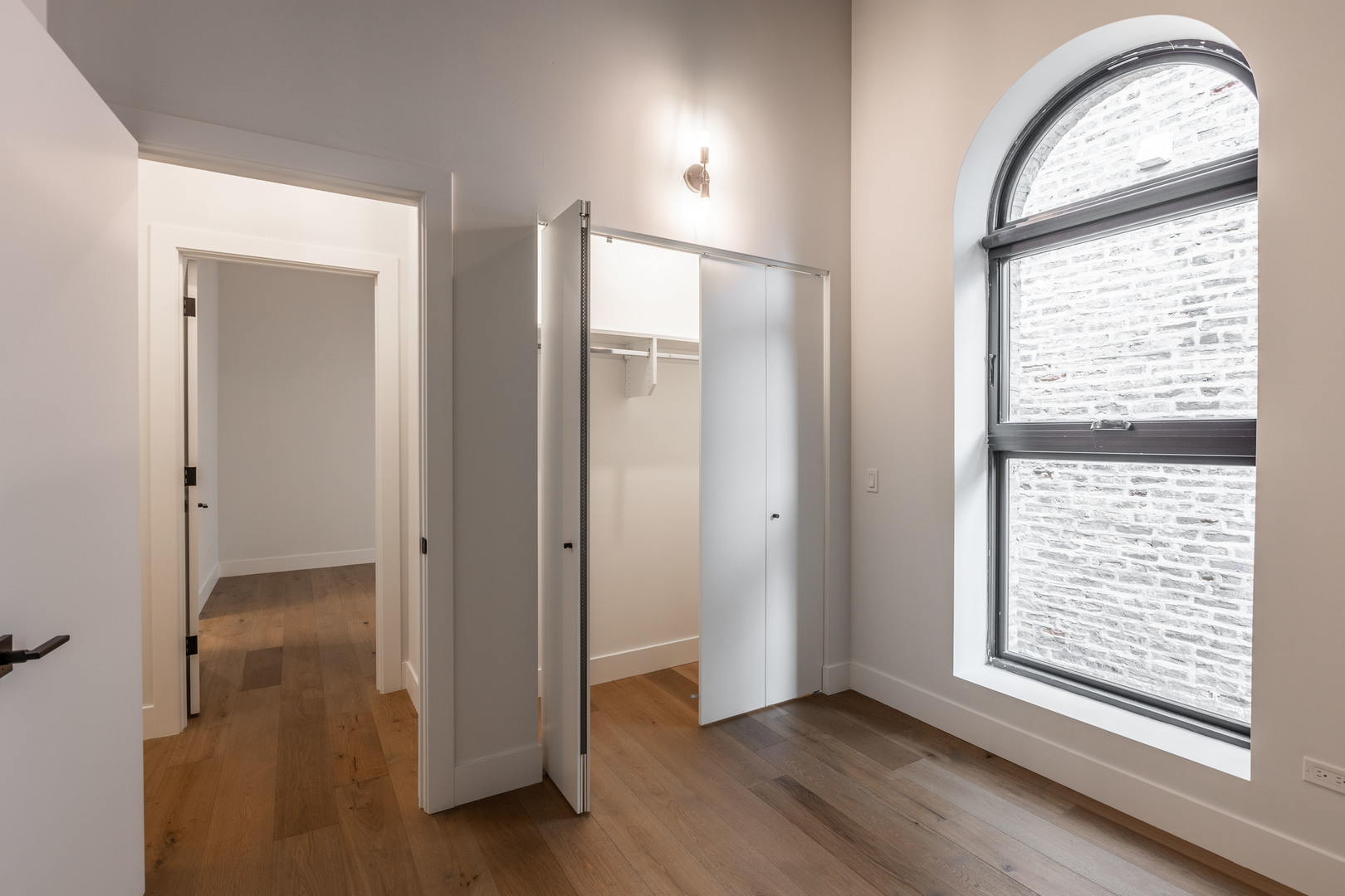 Undisclosed Address Chicago, IL 60647 - Photo 14 of 17 an empty room with window wooden floor and closet