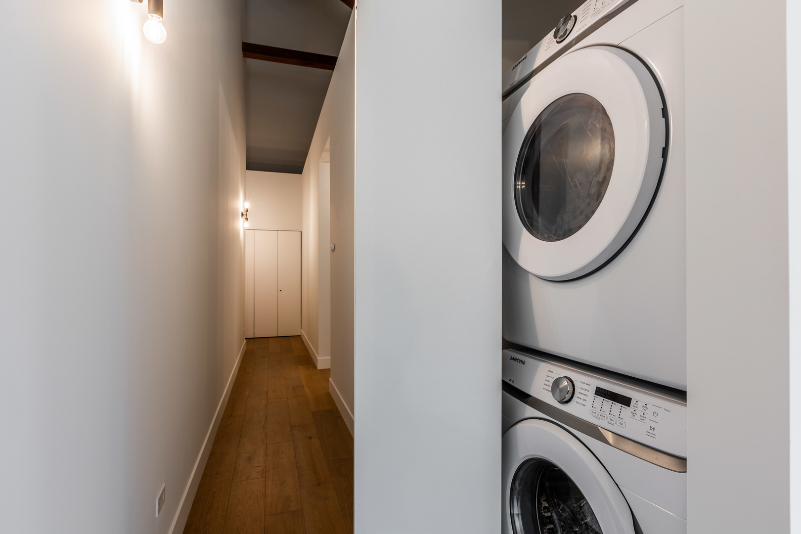 Undisclosed Address Chicago, IL 60647 - Photo 15 of 17 a view of a hallway with washer and dryer