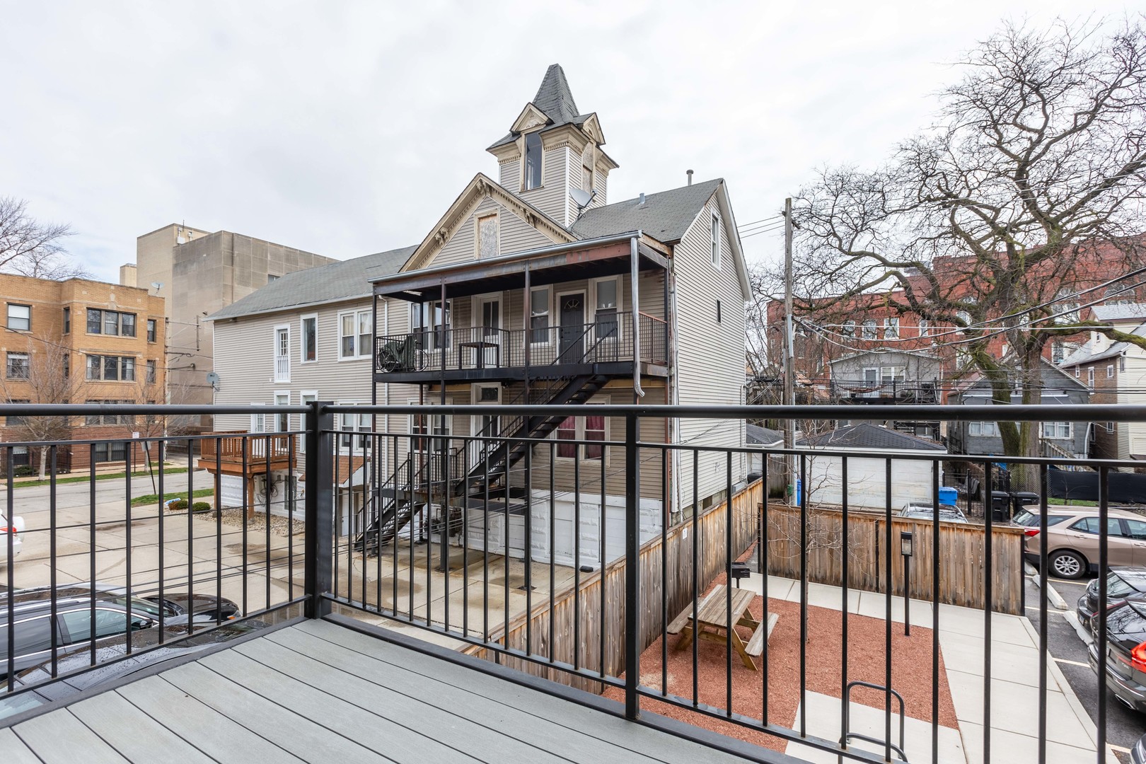Undisclosed Address Chicago, IL 60647 - Photo 16 of 17 a view of a brick house with large windows