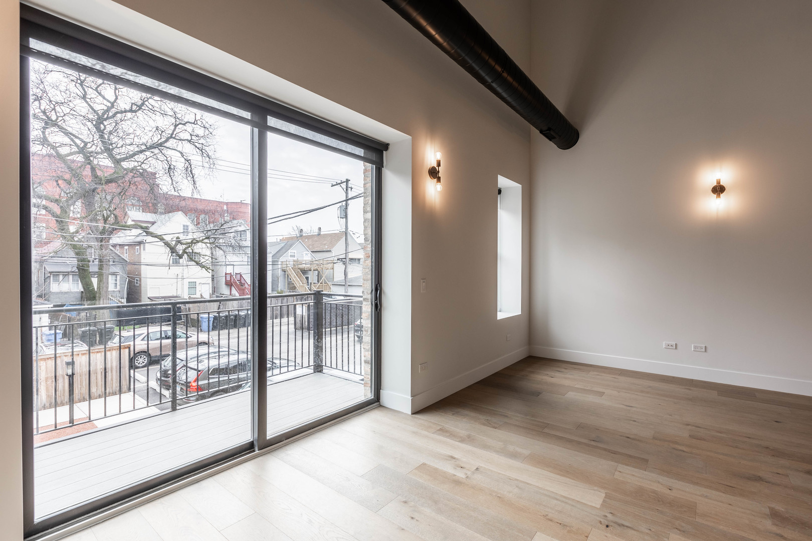 Undisclosed Address Chicago, IL 60647 - Photo 6 of 17 a view of an empty room with wooden floor and windows