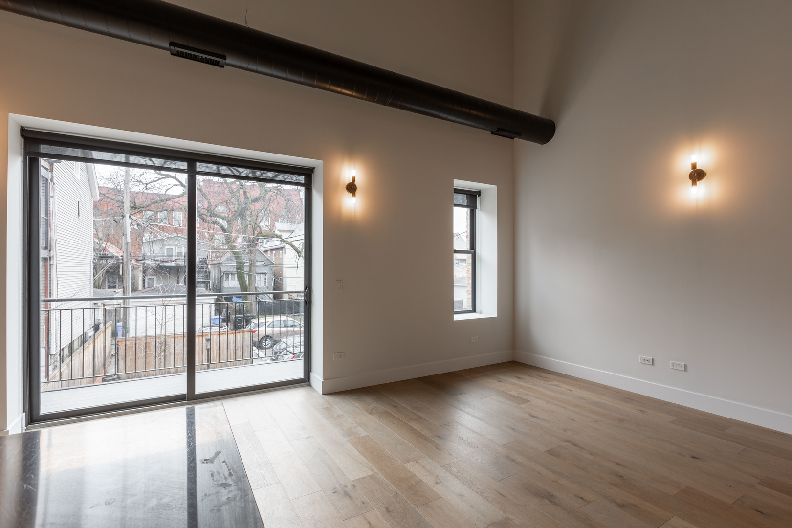 Undisclosed Address Chicago, IL 60647 - Photo 7 of 17 a view of a room with wooden floor and windows