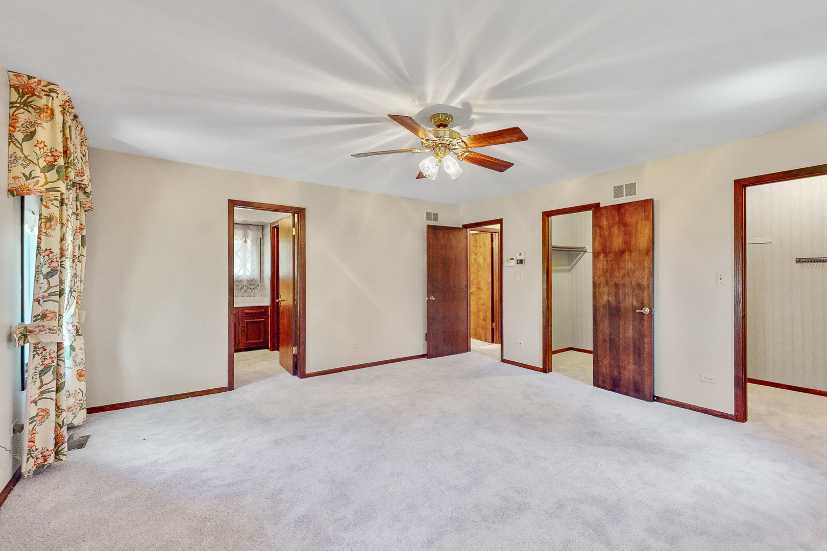 309 Hambletonian Drive Oak Brook, IL 60523 - Photo 27 of 39 an empty room with windows and fan