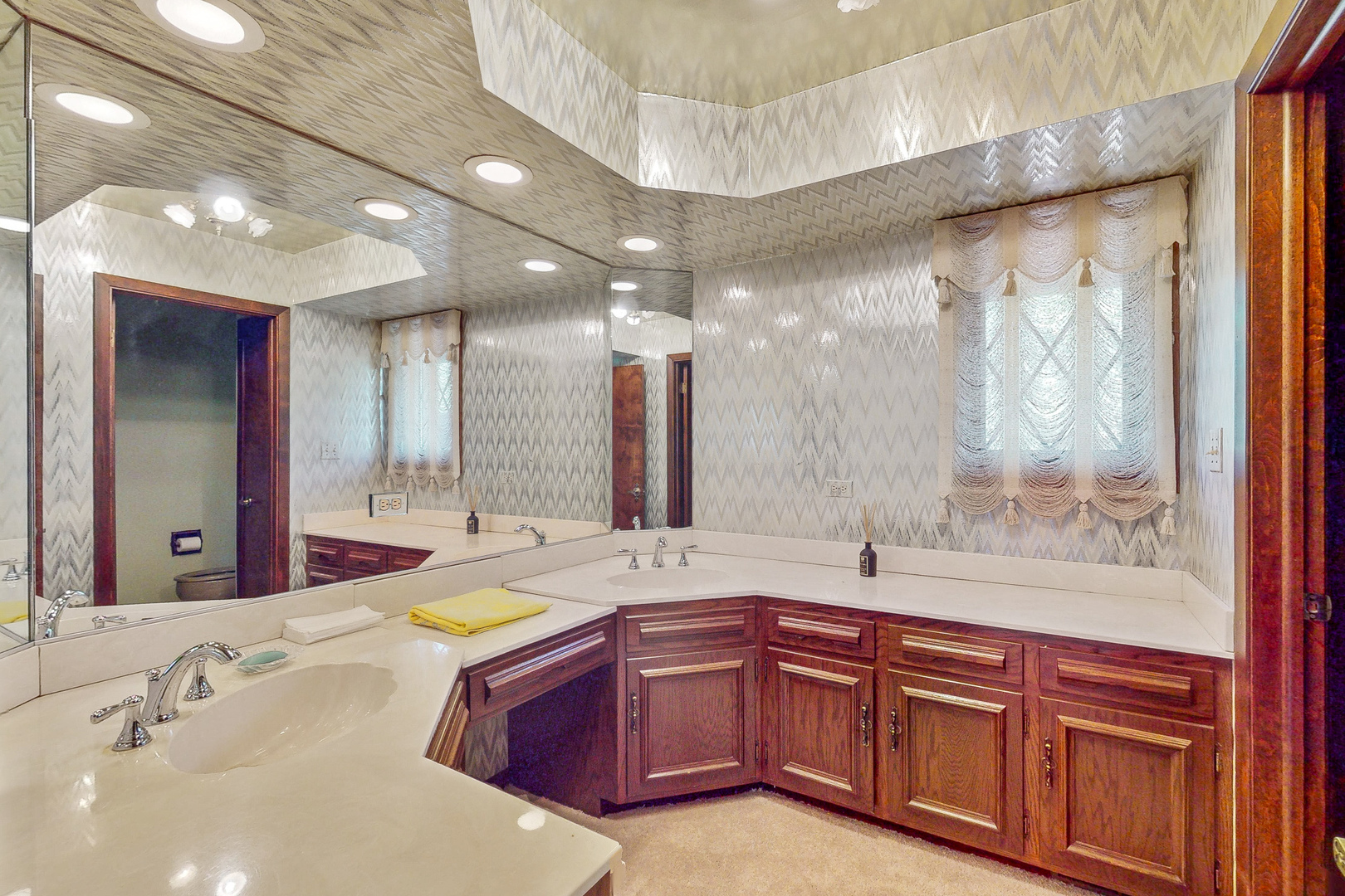 309 Hambletonian Drive Oak Brook, IL 60523 - Photo 28 of 39 a bathroom with a granite countertop sink and a large mirror