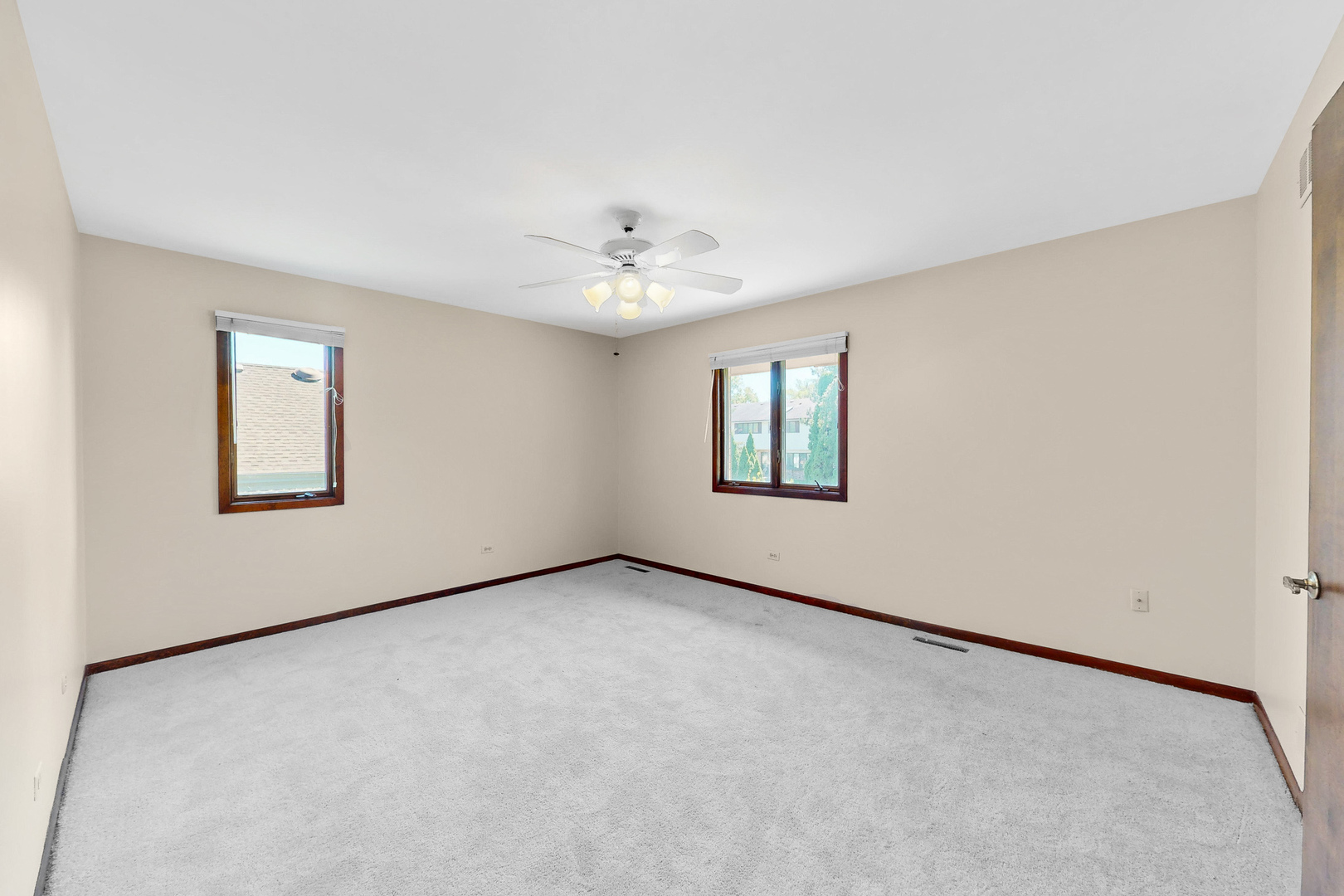 309 Hambletonian Drive Oak Brook, IL 60523 - Photo 33 of 39 an empty room with windows and ceiling fan