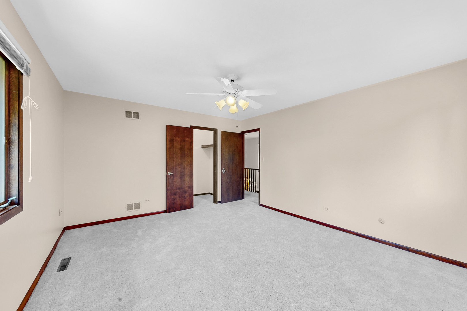 309 Hambletonian Drive Oak Brook, IL 60523 - Photo 34 of 39 an empty room with a ceiling fan and a window
