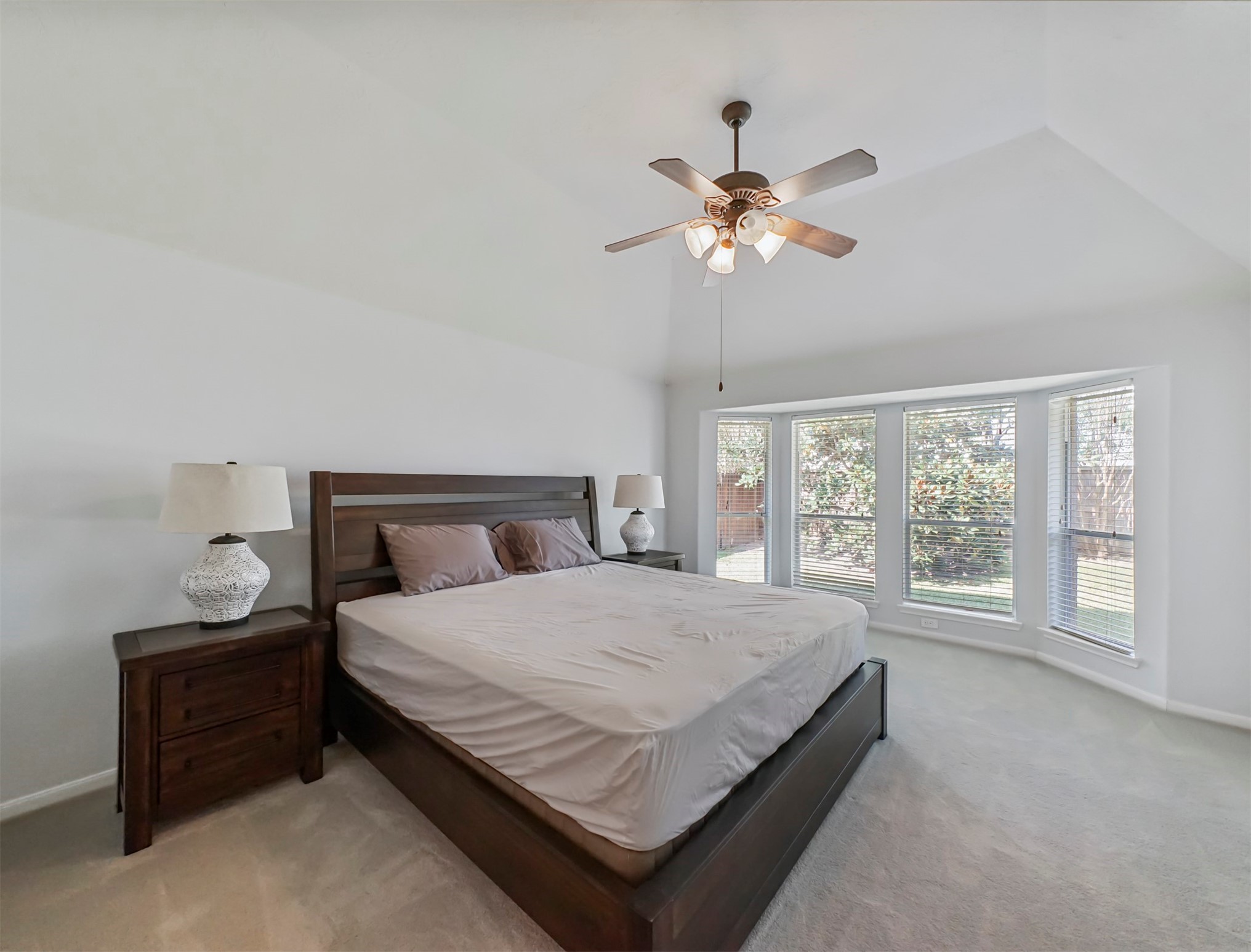 8214 Garrison Point Drive Houston, TX 77040 - Photo 16 of 37 a large bed sitting in a bedroom next to a window