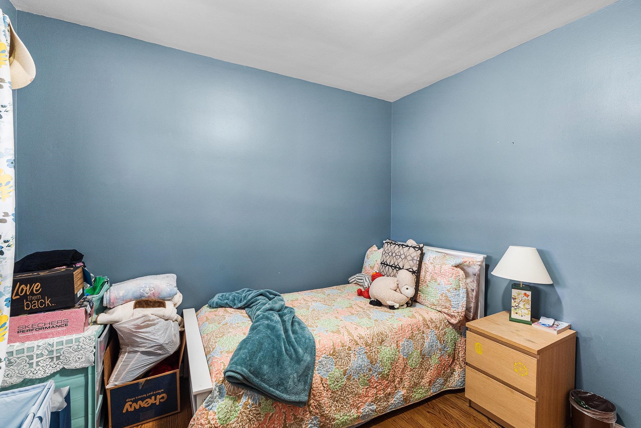 6 Mutillod Lane Secaucus, NJ 07094 - Photo 15 of 41 a bedroom with a bed and a lamp on dresser