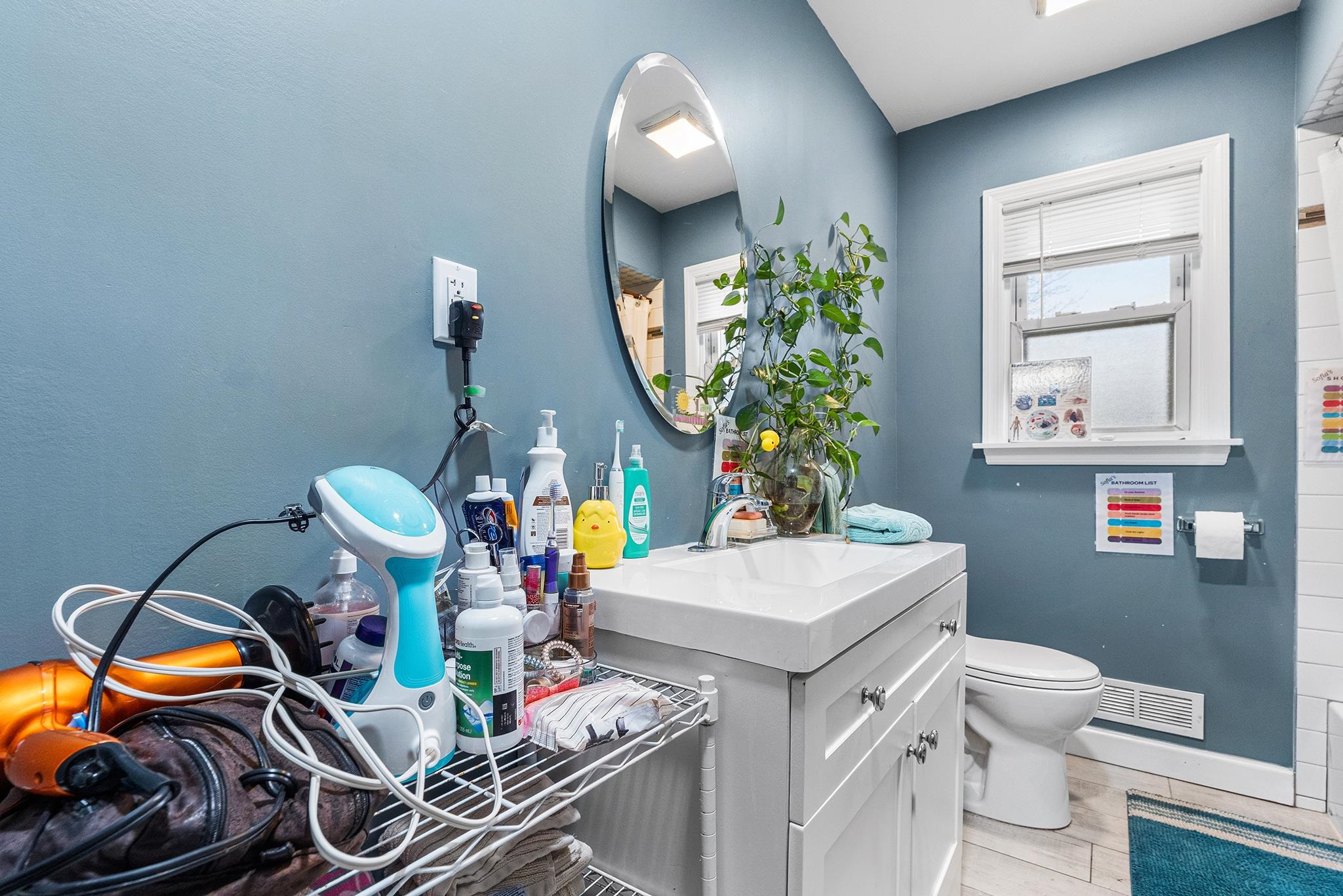 6 Mutillod Lane Secaucus, NJ 07094 - Photo 16 of 41 a bathroom with a sink toilet and mirror
