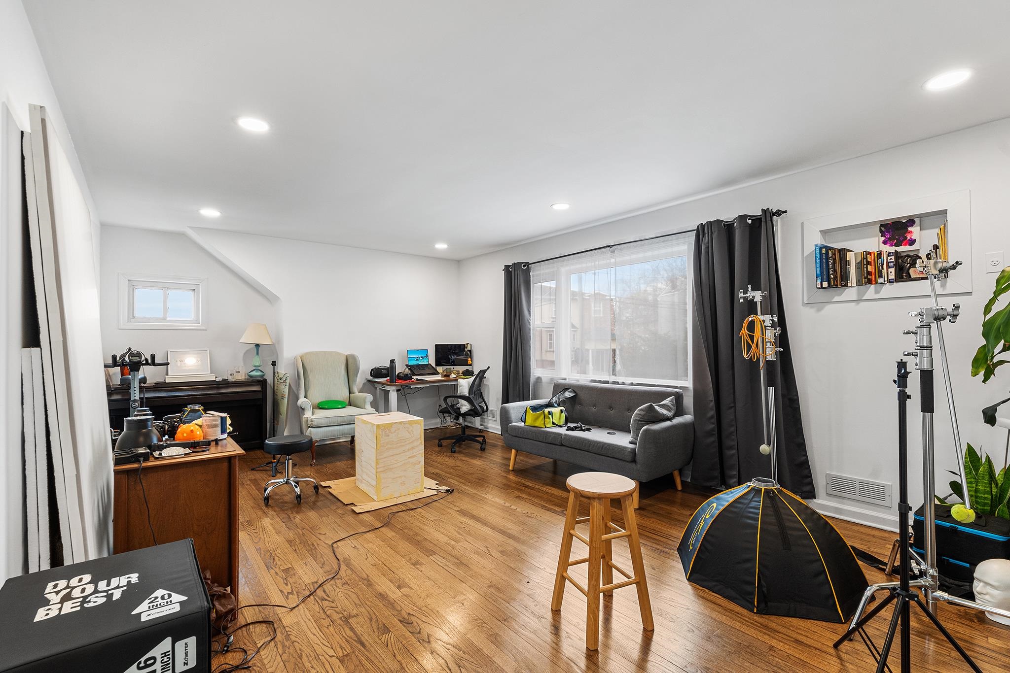 6 Mutillod Lane Secaucus, NJ 07094 - Photo 21 of 41 a living room with furniture a flat screen tv and a floor to ceiling window