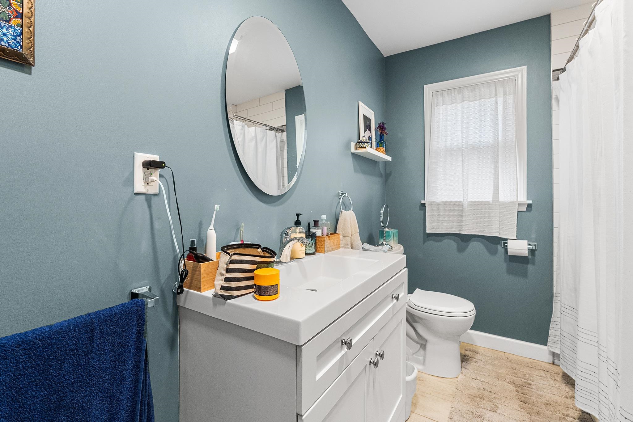 6 Mutillod Lane Secaucus, NJ 07094 - Photo 36 of 41 a bathroom with a sink a toilet and a mirror
